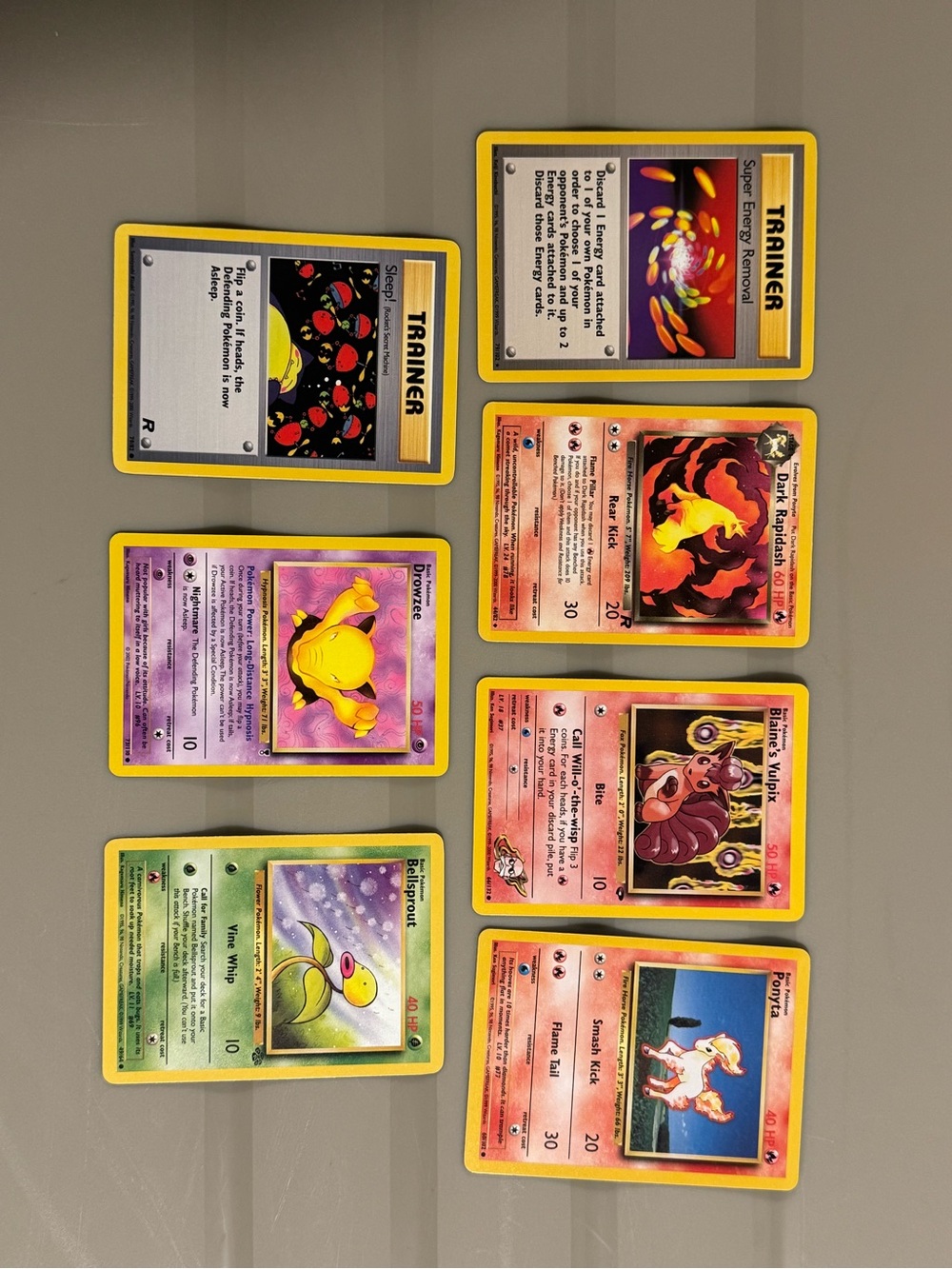 A collection of early Pokémon TCG cards from the 1990s and early 2000s. Set of 7